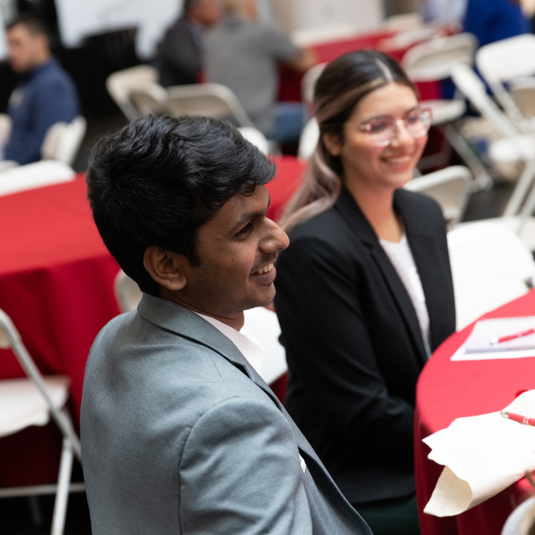 Students listening attentively at a business school event