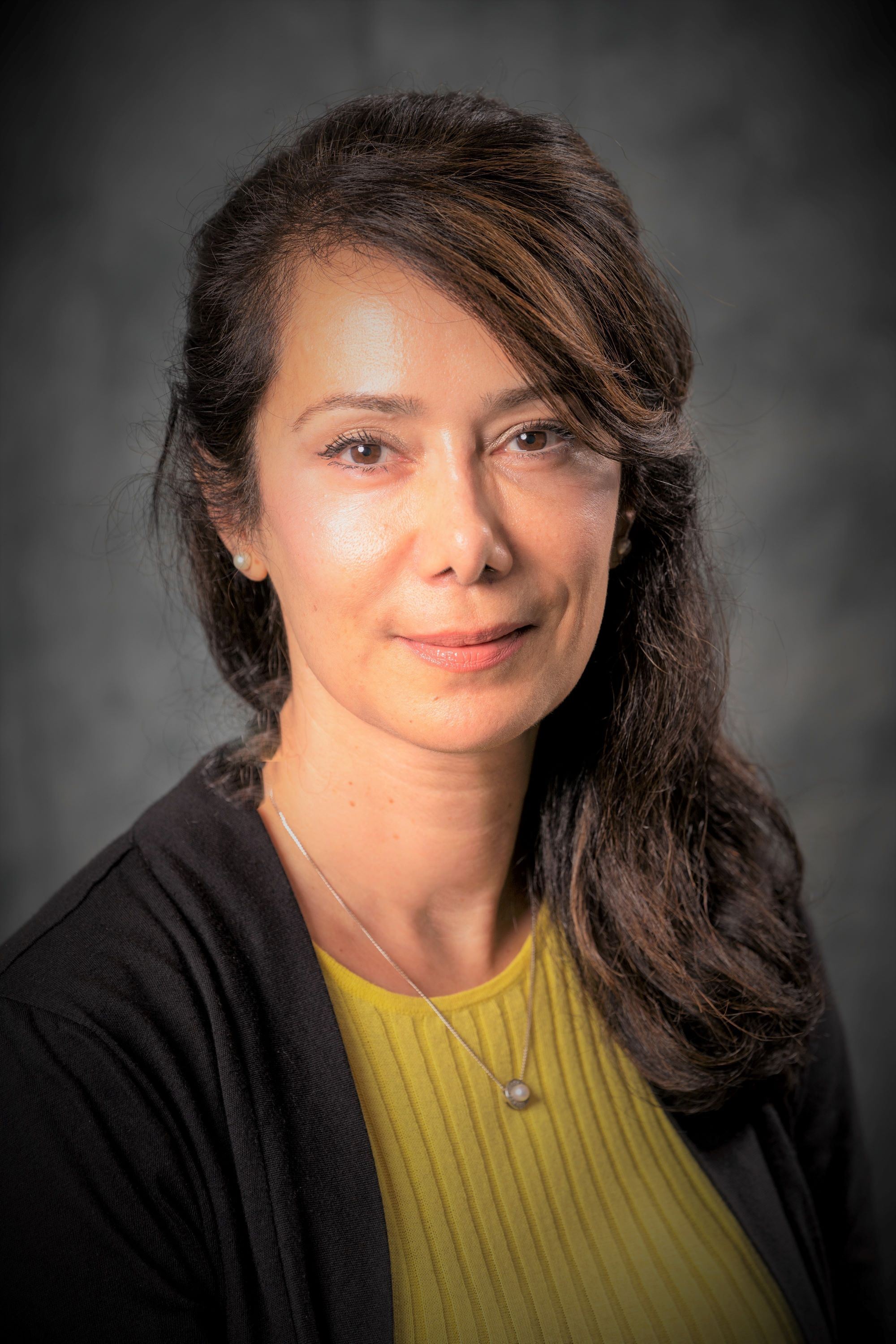 Soraya Zabihi, wearing a yellow shirt and black vest