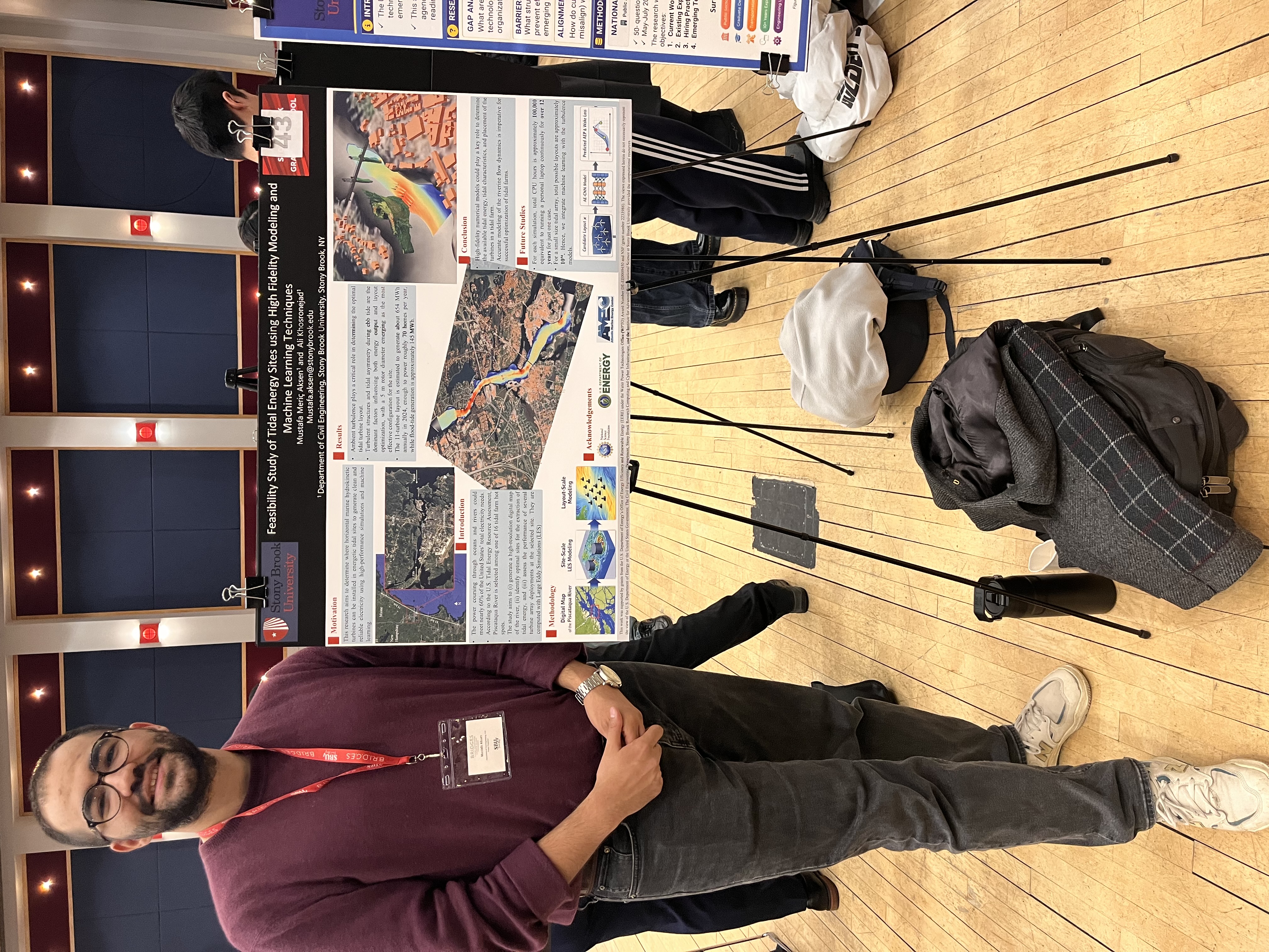 M. Aksen with poster