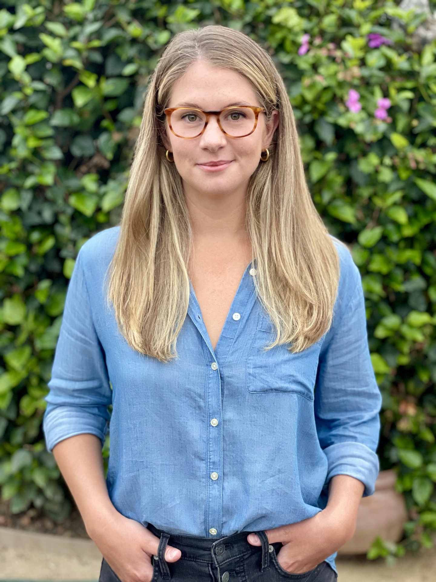 a headshot of the author, Meg Kende