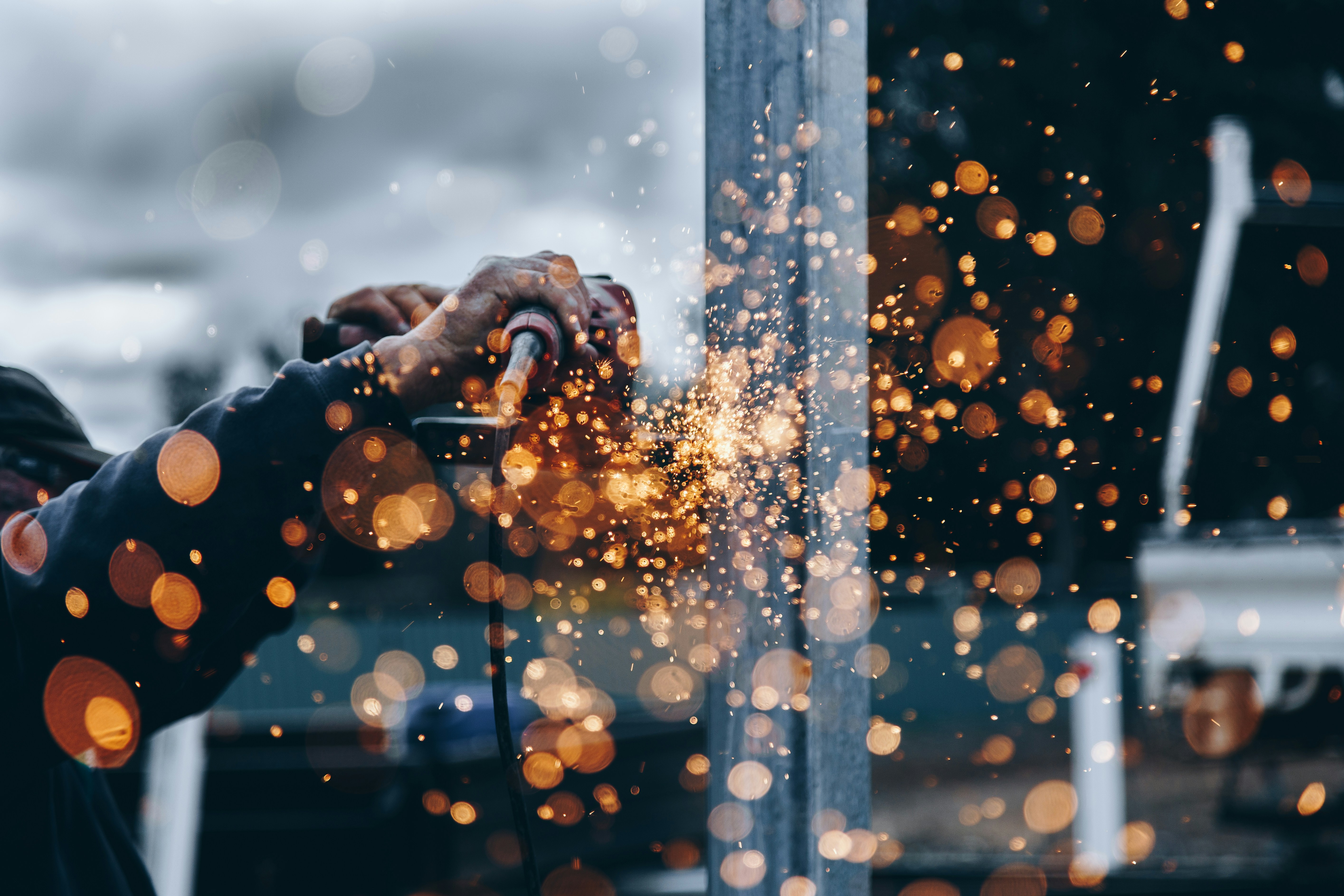 worker cutting metal