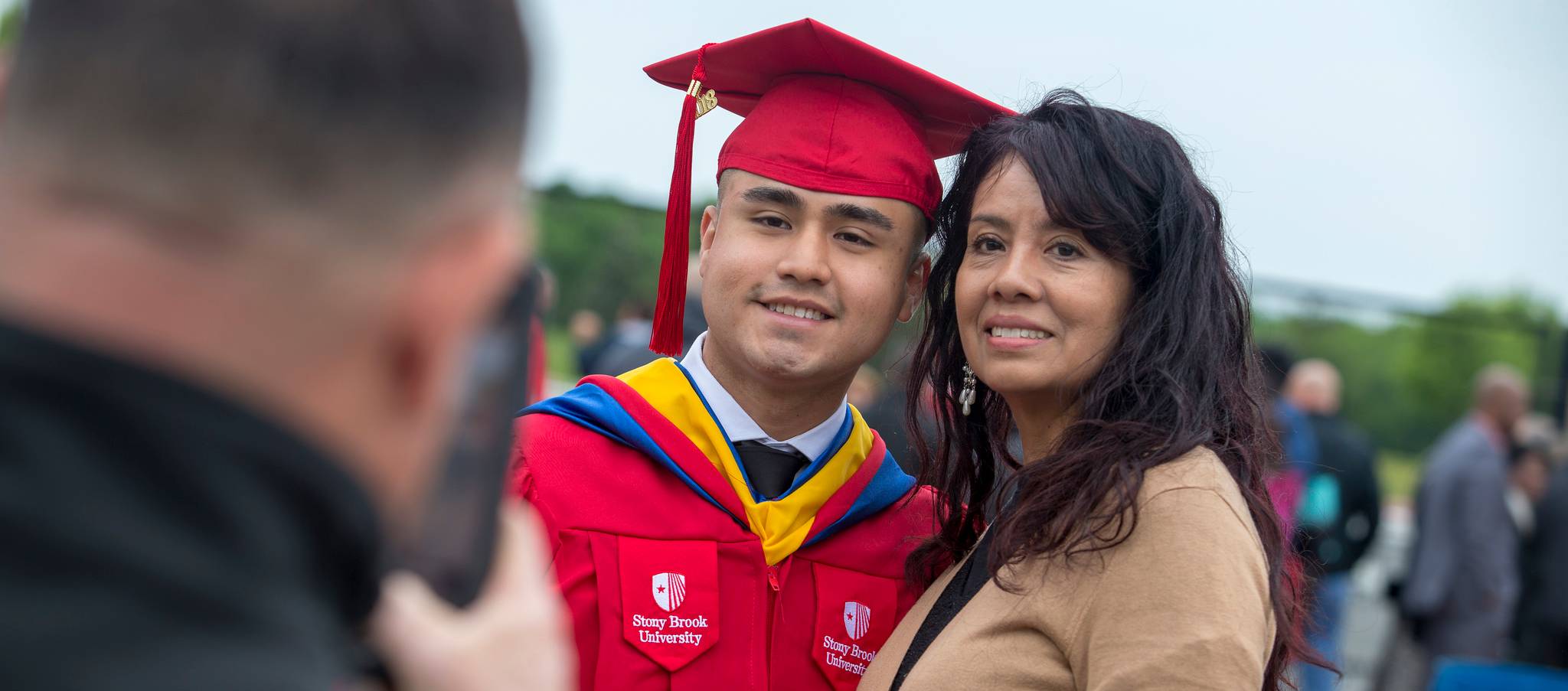 Family posing for photo at graduation