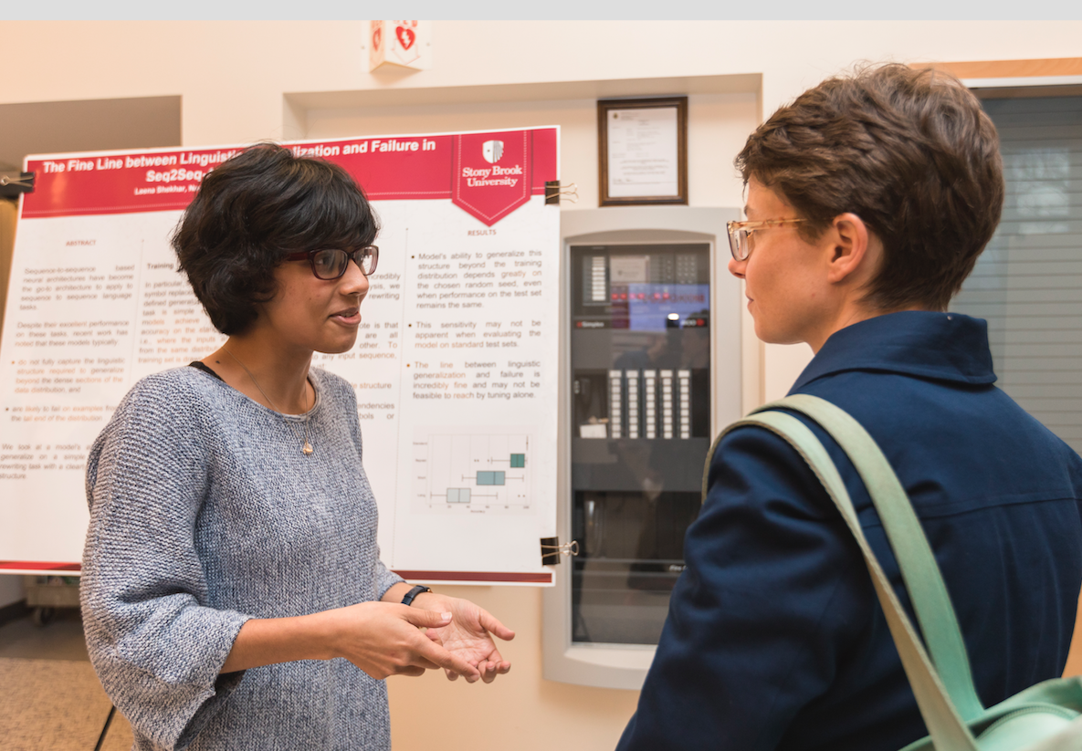 Professor Lynch speaks with a student